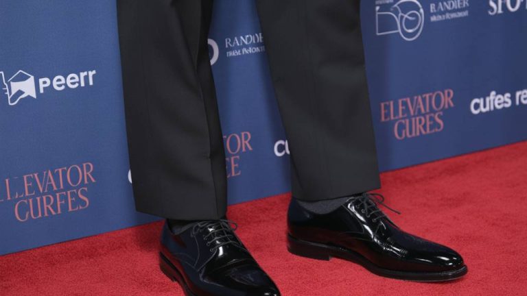 How tall is Andrew Garfield and could elevator shoes enhance his red carpet style?